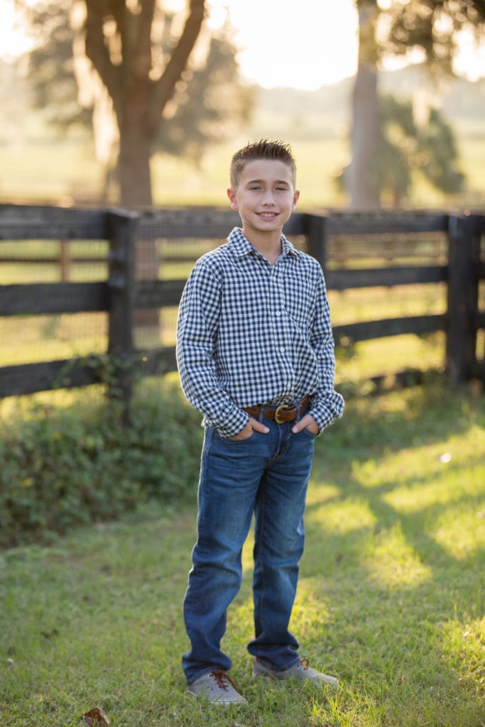 boy posed at horse farm mini session