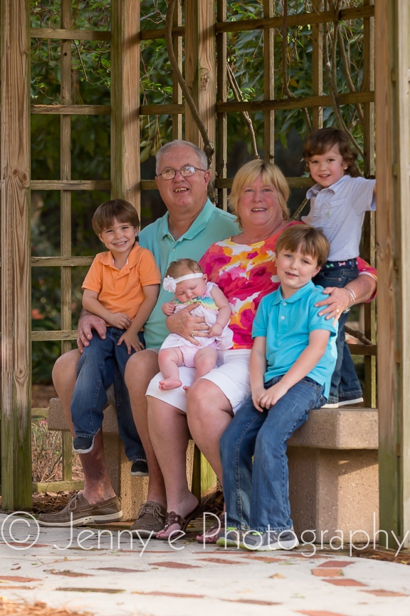 grandchildren posing with their grandparents